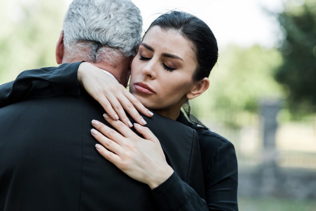 Funeral-attendants-hugging
