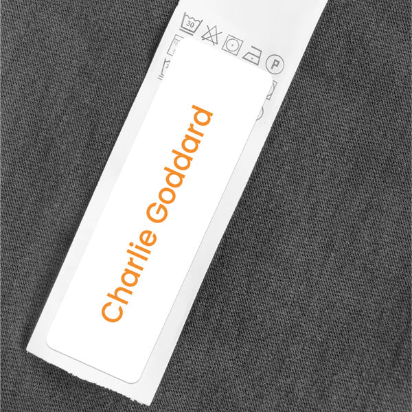 Medium Personalised Stick On Waterproof (Clothing/Equipment) Name Labels - Orange Text - Pack of 36